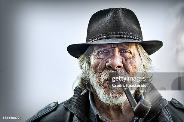 man smoking pipe - carrying in mouth stock pictures, royalty-free photos & images