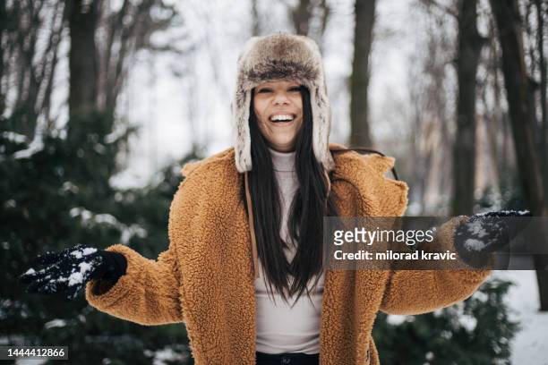 girl enjoys the winter magic. - fake fur stock pictures, royalty-free photos & images