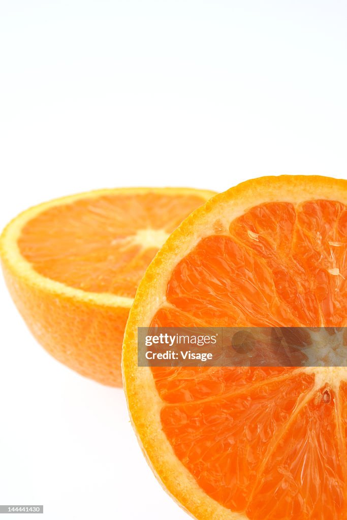Two halves of an orange, partial view