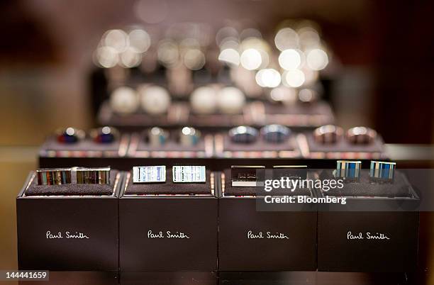 Paul Smith Ltd. Cuff links are displayed in one of the company's stores in Hong Kong, China, on Monday, May 14, 2012. Paul Smith, the British fashion...