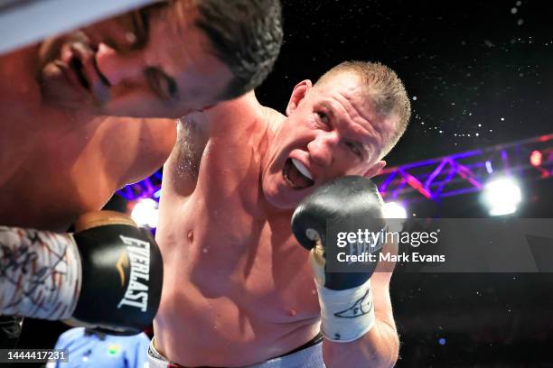 Paul Gallen punches Justin Hodges during the Paul Gallen and Justin Hodges fight night at the Aware Super Theatre on November 23, 2022 in Sydney,...