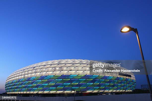 The Allianz Arena is illuminated with white, green and blue lights ahead of the UEFA Champions League Final between FC Bayern Munich and Chelsea on...