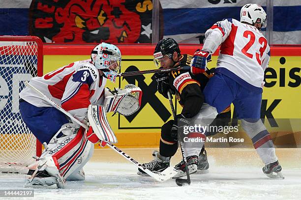 Sebastian Furchner of Germany fails to score over Lars Haugen , goaltender of Norway during the IIHF World Championship group S match between Germany...