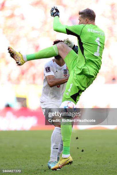 Mehdi Taremi of IR Iran is fouled by Wayne Hennessey of Wales during the FIFA World Cup Qatar 2022 Group B match between Wales and IR Iran at Ahmad...