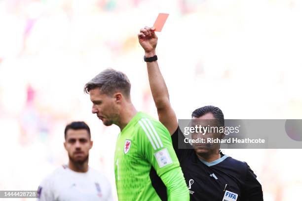 Wayne Hennessey of Wales is shown a red card by referee Mario Alberto Escobar Toca after the Video Assistant Referee review during the FIFA World Cup...