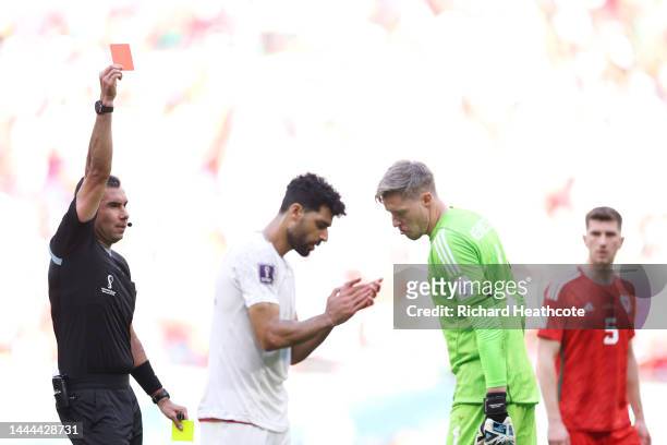 Wayne Hennessey of Wales is shown a red card by referee Mario Alberto Escobar Toca after the Video Assistant Referee review during the FIFA World Cup...