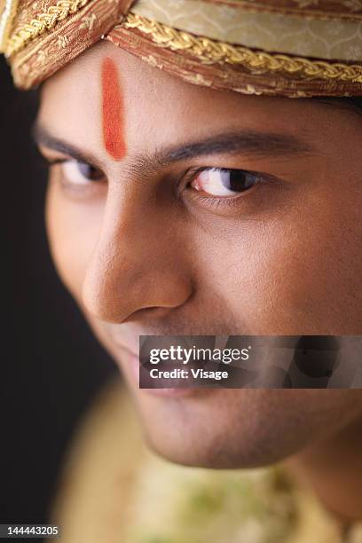 waist-up of an indian groom - indian bridal makeup stock pictures, royalty-free photos & images