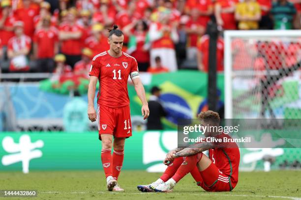 Joe Rodon and Gareth Bale of Wales react after the 0-2 loss during the FIFA World Cup Qatar 2022 Group B match between Wales and IR Iran at Ahmad Bin...