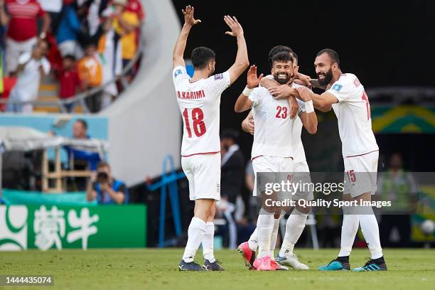 Players of Iran celebrate victory after the FIFA World Cup Qatar 2022 Group B match between Wales and IR Iran at Ahmad Bin Ali Stadium on November...