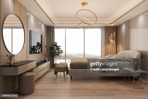 side view of elegant bedroom interior with double bed, television set, night table and seaview through window - slaapkamer zijaanzicht stockfoto's en -beelden