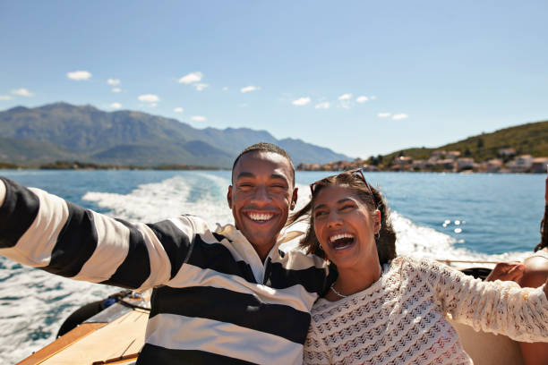 happy young couple taking selfie in boat - good mood stock pictures, royalty-free photos & images