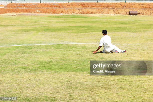 fielder trying to stop the ball - fielder stock pictures, royalty-free photos & images
