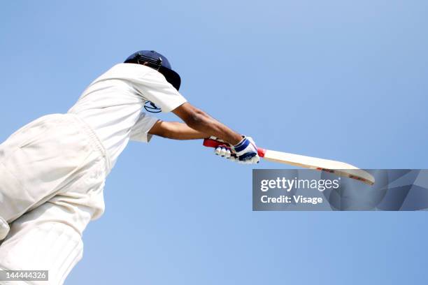 batsman holding a bat - cricket bat stock pictures, royalty-free photos & images