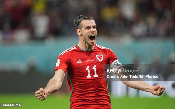 Gareth Bale of Wales scores a goal and celebrates after a FIFA World Cup Qatar 2022 Group B match between Wales and USMNT at Ahmad Bin Ali Stadium on...