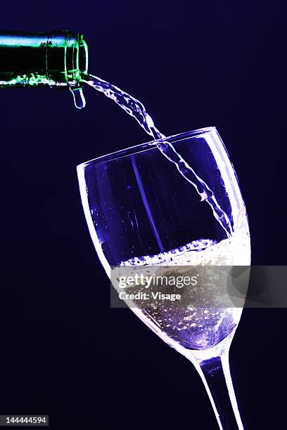 close up shot of a glass being filled with alcohol - visage close up stock pictures, royalty-free photos & images