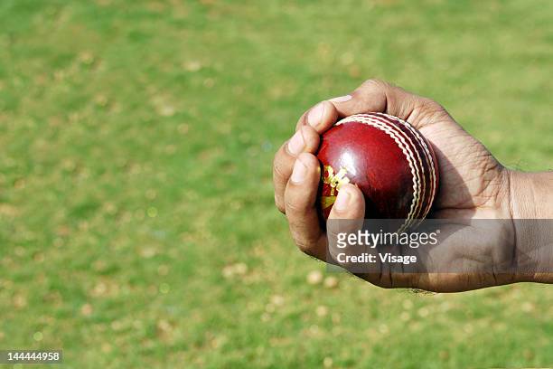 close-up of a catch - cricket ball close up stock pictures, royalty-free photos & images