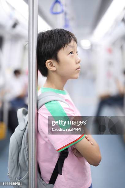 the little boy on the subway - kid waiting stock pictures, royalty-free photos & images