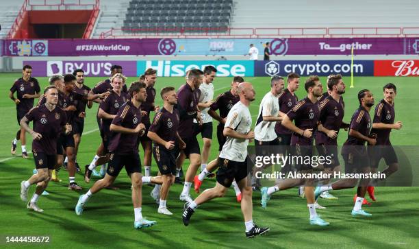 Germany players warm u during the Germany Training Session at Al Shamal Stadium on November 25, 2022 in Al Ruwais, Qatar.