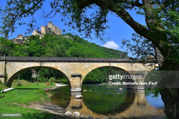 bridge over the dordogne at castenaud-la-chapelle - dordogne river stock pictures, royalty-free photos & images
