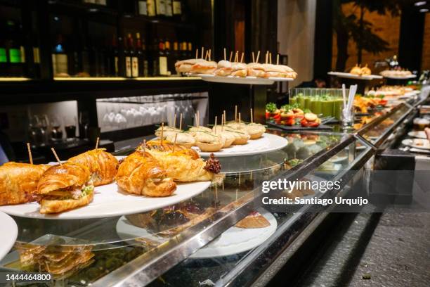 row of tapas on a bar - tapas spain stock pictures, royalty-free photos & images