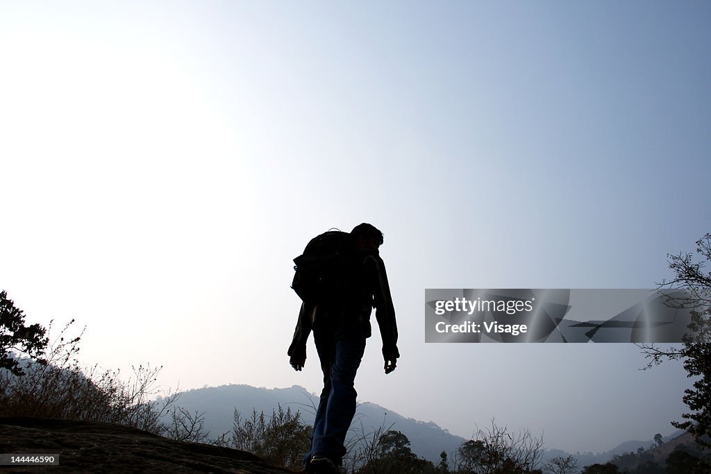A man on a trekking journey
