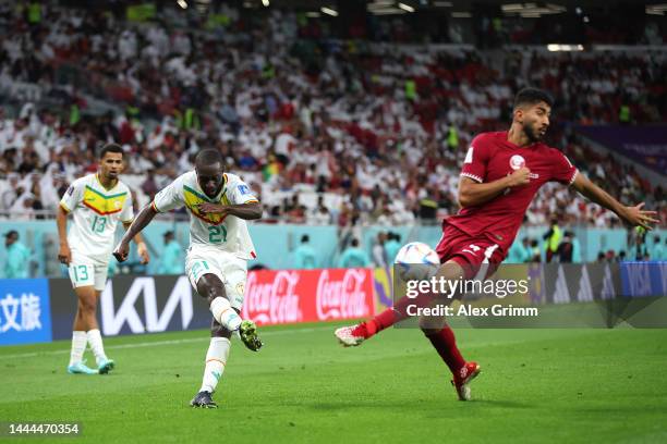 Youssouf Sabaly of Senegal crosses during the FIFA World Cup Qatar 2022 Group A match between Qatar and Senegal at Al Thumama Stadium on November 25,...