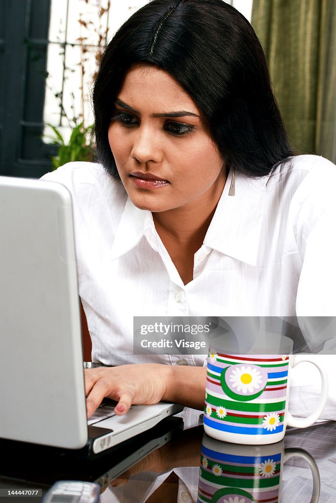 A woman working on her laptop