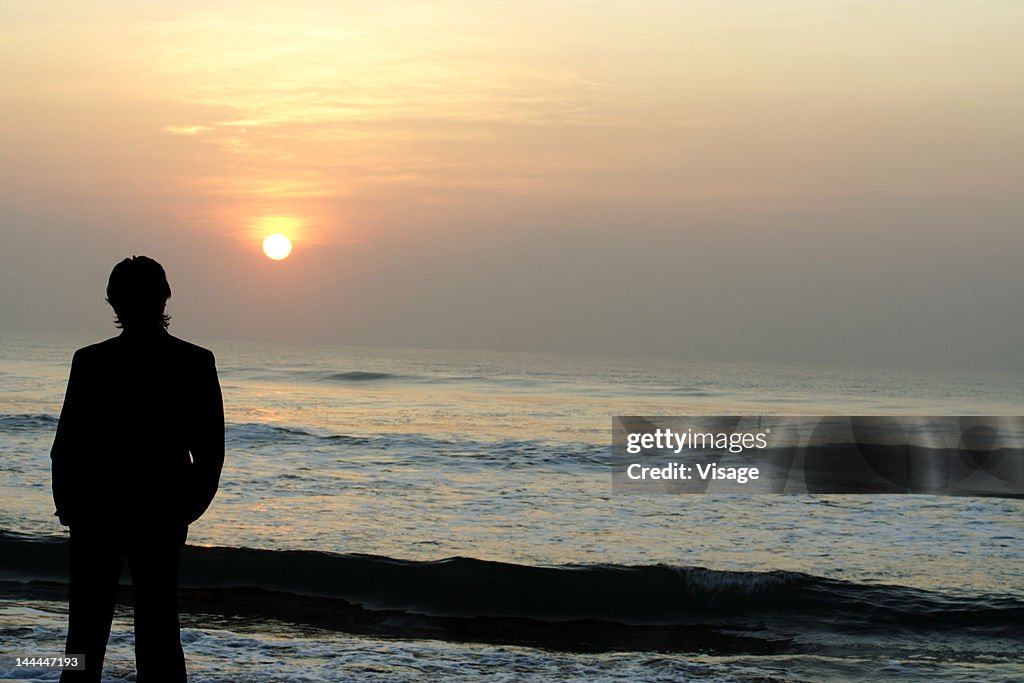 Silhouette of a man at a beach