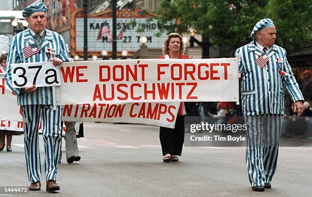 Members from an Auschwitz memorial group march during the Memorial Day Parade May 27, 2000 in Chicago. The parade, consisting of over 160 marching...