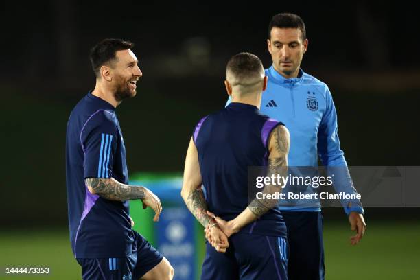 Lionel Messi of Argentina reacts with Lionel Scaloni, Head Coach of Argentina, during the Argentina MD-1 training session at Qatar University on...