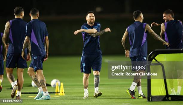 Lionel Messi of Argentina warms up during the Argentina MD-1 training session at Qatar University on November 25, 2022 in Doha, Qatar.