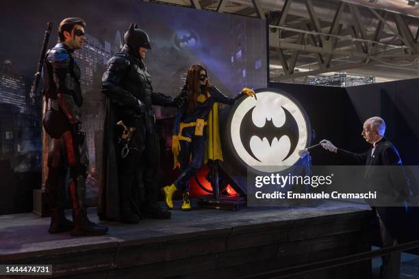 Cosplayers wearing Robin, Batman, Batgirl and Alfred Pennyworth stand on a stage during Milan Games Week & Cartoomics 2022 at Fiera Milano Rho on...