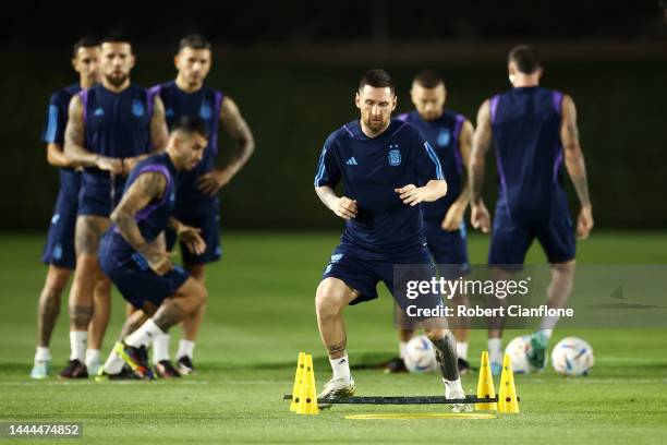 Lionel Messi of Argentina warms up during the Argentina MD-1 training session at Qatar University on November 25, 2022 in Doha, Qatar.