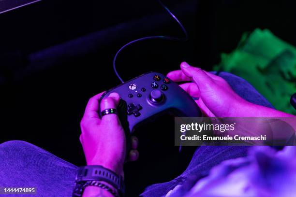 Man uses a Xbox gamepad during Milan Games Week & Cartoomics 2022 at Fiera Milano Rho on November 25, 2022 in Milan, Italy. Milan Games Week &...