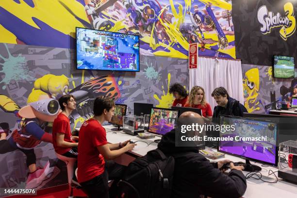 People play video games at the Japanese publisher Nintendo Switch's stand during Milan Games Week & Cartoomics 2022 at Fiera Milano Rho on November...
