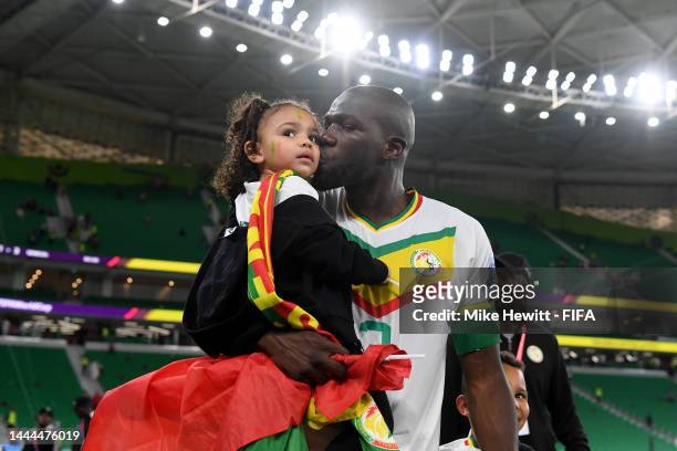 Kalidou Koulibaly of Senegal kisses his daughter after his side's 3-1 victory in the FIFA World Cup Qatar 2022 Group A match between Qatar and...