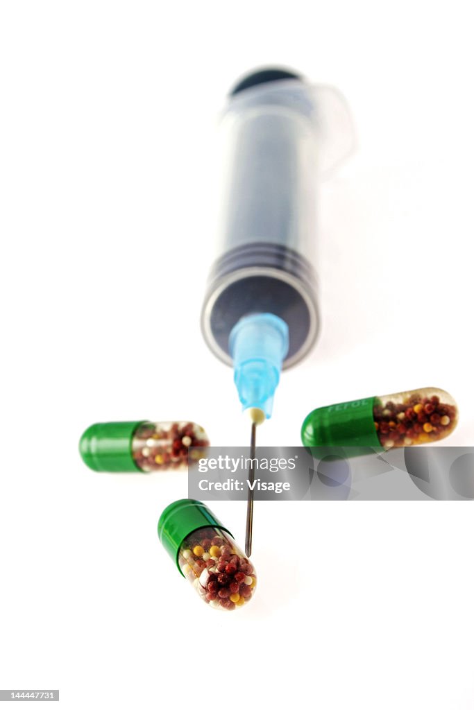 Close up of Capsules and syringe