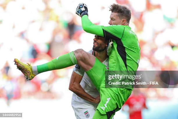 Mehdi Taremi of IR Iran is fouled by goalkeeper Wayne Hennessey of Wales during the FIFA World Cup Qatar 2022 Group B match between Wales and IR Iran...