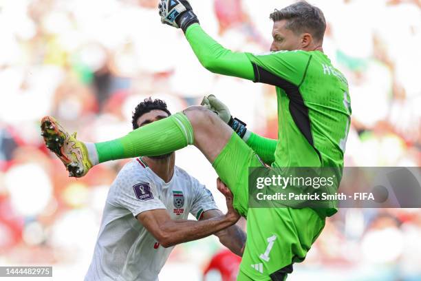 Mehdi Taremi of IR Iran is fouled by goalkeeper Wayne Hennessey of Wales during the FIFA World Cup Qatar 2022 Group B match between Wales and IR Iran...