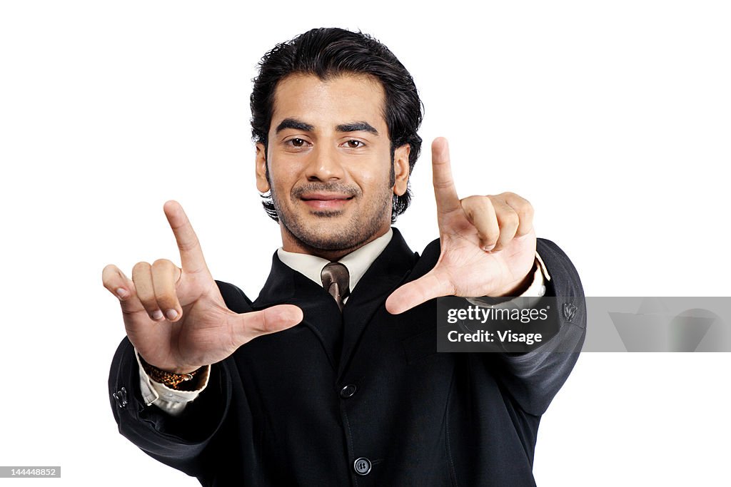 Close up of a man making a hand gesture