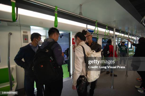 People take a look at the prototype of Bogota's metro car during the unveiling event of Bogota's Metro car as Bogota's metro system starts works to...