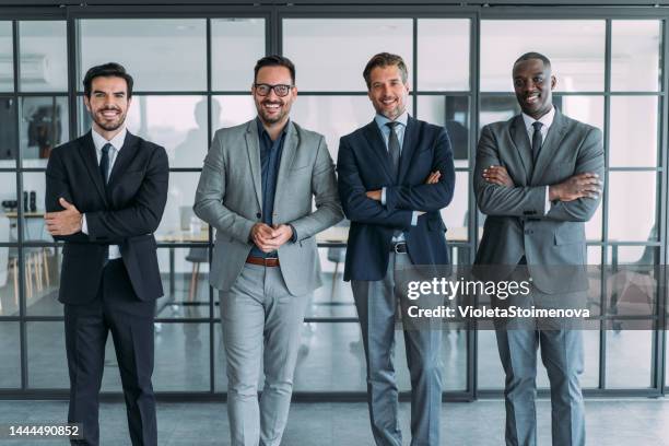 successful male business team - only men group standing stock pictures, royalty-free photos & images
