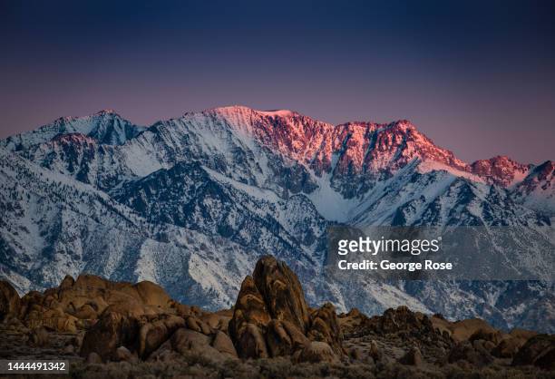 The snowcapped Sierra Nevada mountain range is viewed before sunrise from the scenic Alabama Hills on November 14 near Lone Pine, California. Home to...