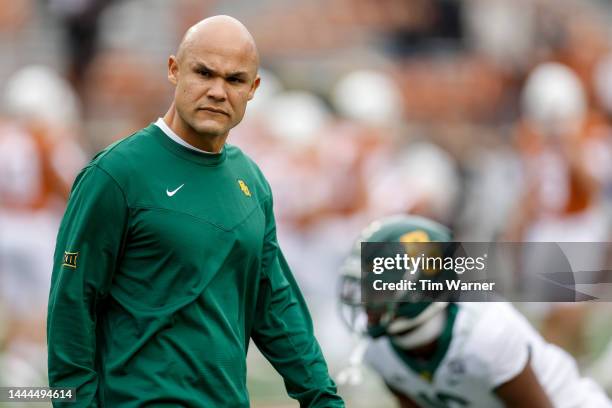 Head coach Dave Aranda of the Baylor Bears watches players warm up before the game against the Texas Longhorns at Darrell K Royal-Texas Memorial...