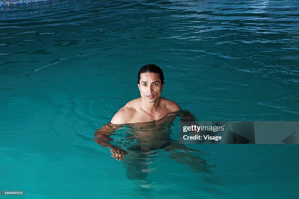 A man in swimming pool