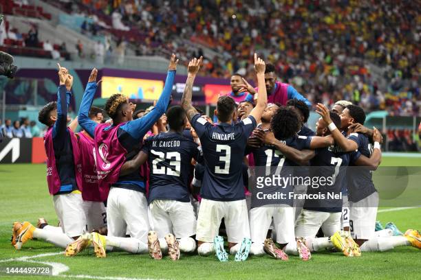 Enner Valencia of Ecuador celebrates with teammates after scoring their team's first goal during the FIFA World Cup Qatar 2022 Group A match between...