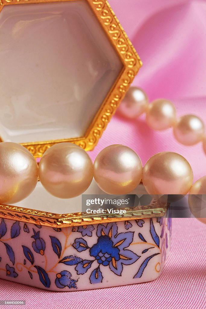 Close up of pearl strings on a jewellery box