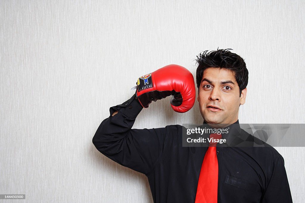 Portrait of a man wearing boxing gloves