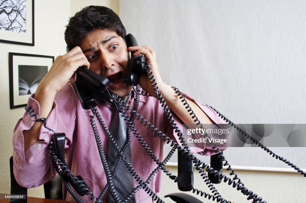 Man Using Many Phones Man Talking On Many Phones High-Res Stock Photo - Getty Images