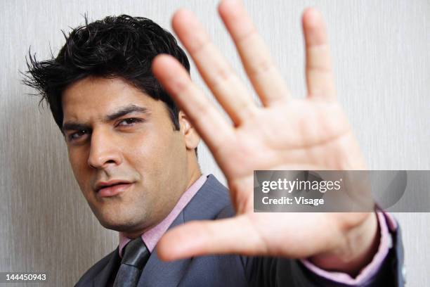 close up of a business man gesturing stop - visage close up stock pictures, royalty-free photos & images